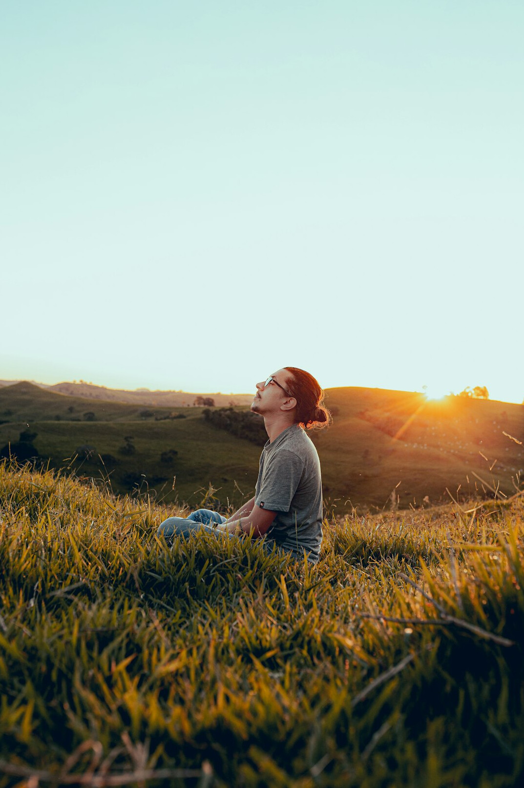 person meditating in nature