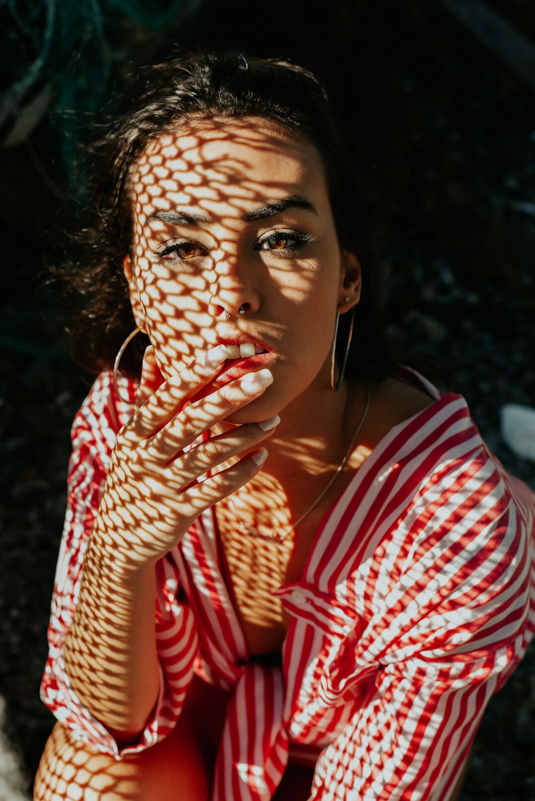 Brazilian woman speaking confidently while gesturing during a conversation